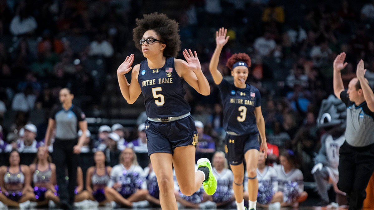 Notre Dame Fighting Irish guard Olivia Miles (5) celebrates a three-pointer as TCU Horned Frogs face off with Notre Dame Fighting Irish during the Sweet 16 at Legacy Arena