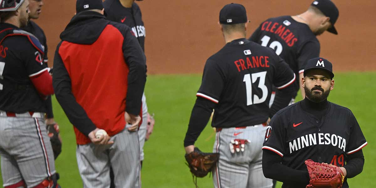 Minnesota Twins starting pitcher Pablo Lopez (49) walks to the dugout during a pitching change in the seventh inning against the Cleveland Guardians at Progressive Field.