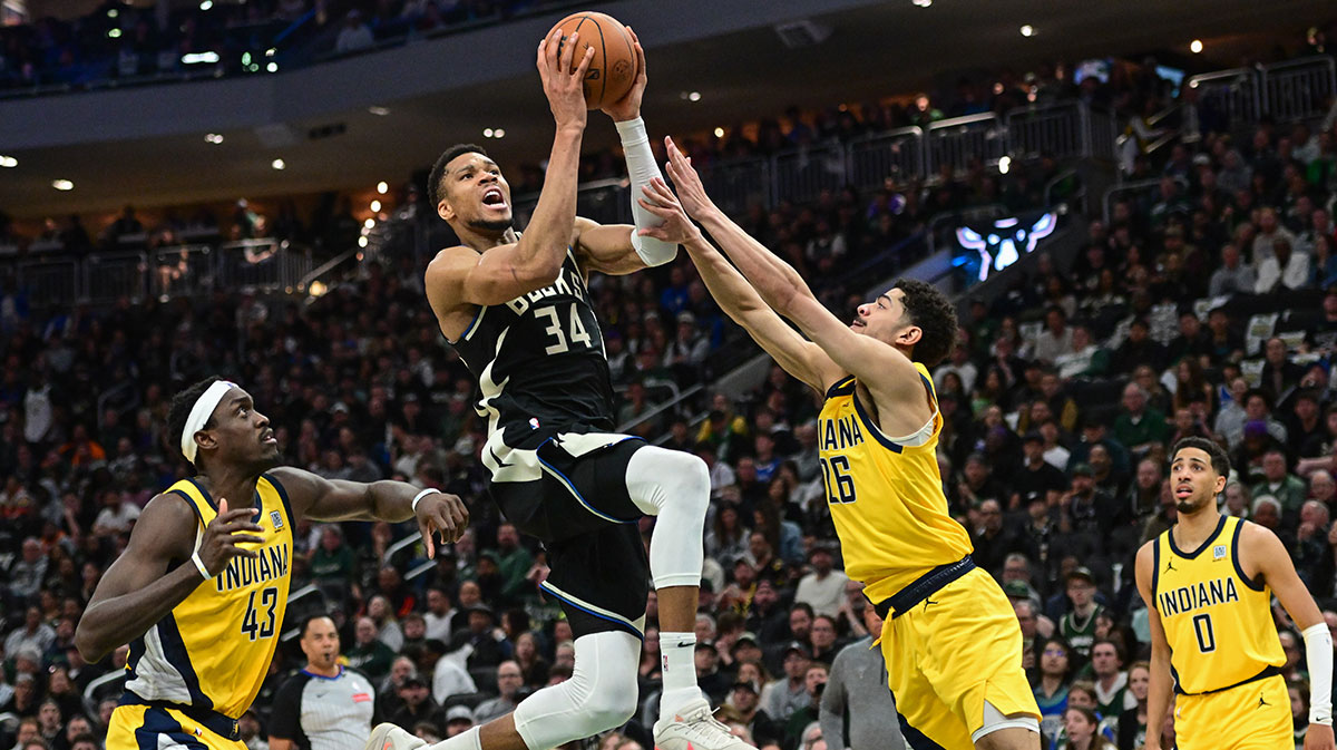 Milwaukee Bucks forward Giannis Antetokounmpo (34) takes a shot between Indiana Pacers forward Pascal Siakam (43) and guard Ben Sheppard (26) in the third quarter during game four of first round for the 2024 NBA Playoffs at Fiserv Forum.