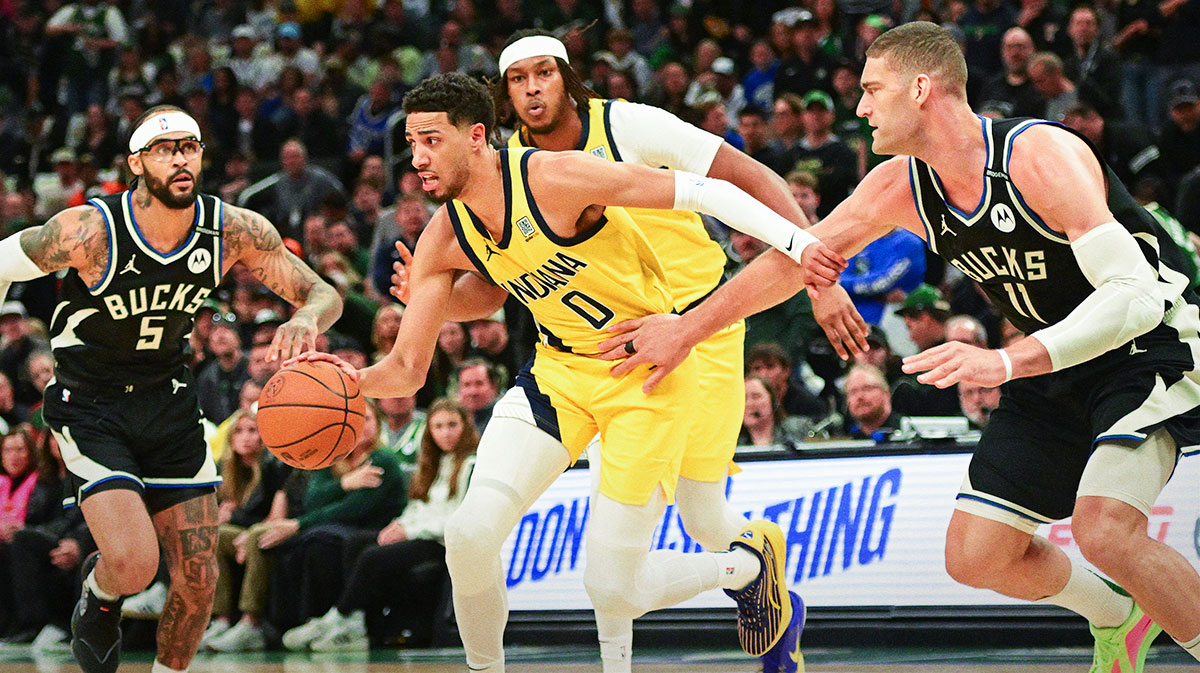 Indiana Pacers guard Tyrese Haliburton (0) drives for the basket against Milwaukee Bucks center Brook Lopez (11) in the first quarter during game four of first round for the 2024 NBA Playoffs at Fiserv Forum.