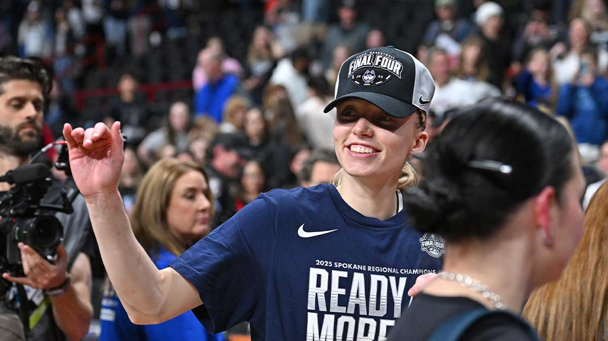 UConn Huskies guard Paige Bueckers (5) waves to the crowd after a Elite 8 NCAA Tournament basketball game against the USC Trojans at Spokane Arena