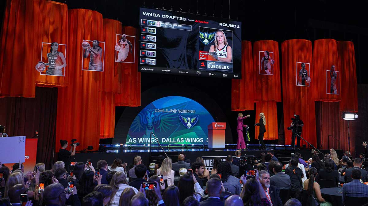 Apr 14, 2025; New York, New York, USA; Paige Bueckers is greeted by WNBA commissioner Cathy Engelbert after being selected with the number one overall pick to the Dallas Wings in the 2025 WNBA Draft at The Shed at Hudson Yards. Mandatory Credit: Vincent Carchietta-Imagn Images
