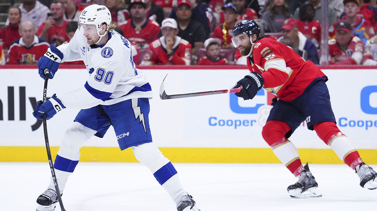 Tampa Bay Lightning defenseman J.J. Moser (90) passes the puck against Florida Panthers defenseman Aaron Ekblad (5) during the first period in game four of the first round of the 2025 Stanley Cup Playoffs at Amerant Bank Arena.