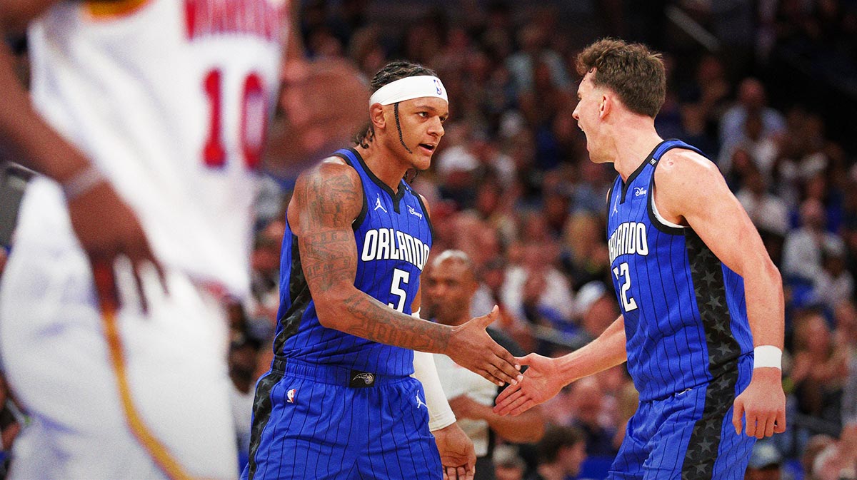 Orlando Magic forward Paolo Banchero (5) and forward Franz Wagner (22) celebrate after a basket against the Golden State Warriors in the second quarter at Kia Center.