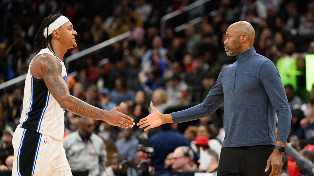 Orlando Magic forward Paolo Banchero (5) and head coach Jamahl Mosley react during the second quarter against the Washington Wizards at Capital One Arena.