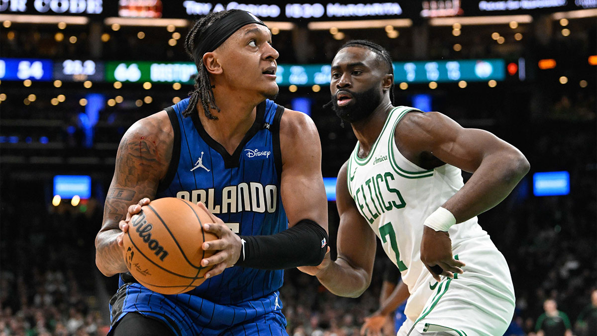 Orlando Magic forward Paolo Banchero (5) looks to shoot through the defense of Boston Celtics guard Jaylen Brown (7) during the first half at TD Garden.