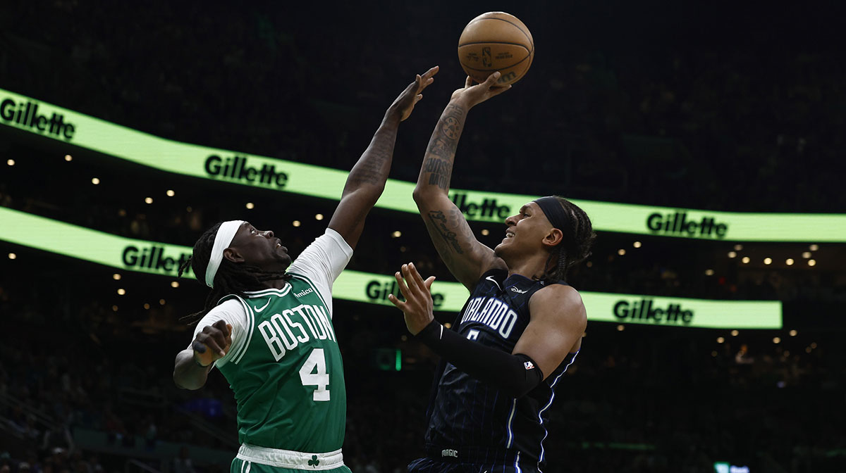 Orlando Magic forward Paolo Banchero (5) shoots over Boston Celtics guard Jrue Holiday (4) during the second quarter of game two of the first round of the 2024 NBA Playoffs at TD Garden.
