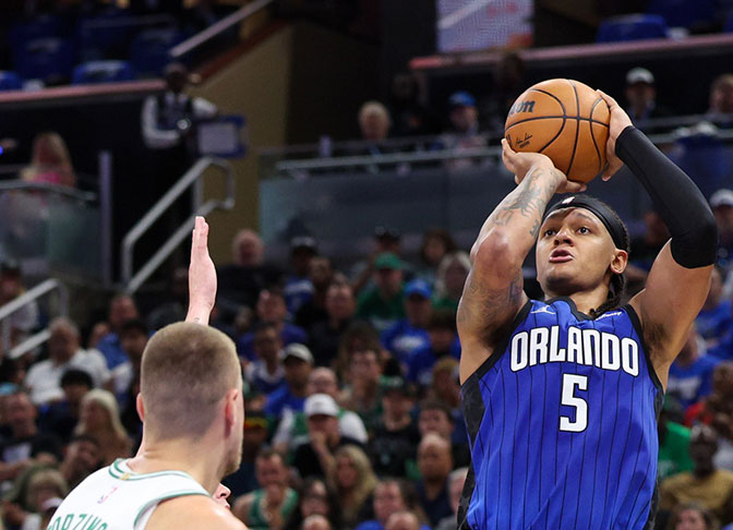 Orlando Magic forward Paolo Banchero (5) shoots the ball against the Boston Celtics in the second quarter during game four of first round for the 2025 NBA Playoffs at Kia Center.