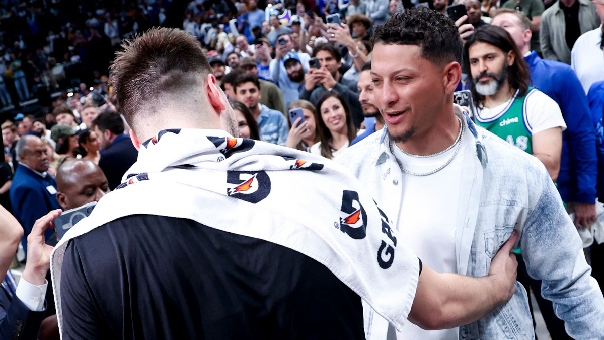 Los Angeles Lakers guard Luka Doncic (77) hugs Kansas City Chiefs quarterback Patrick Mahomes after the game against the Dallas Mavericks at American Airlines Center.