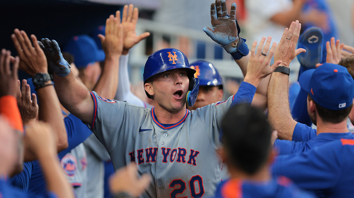New York Mets first baseman Pete Alonso (20) celebrates with teammates after hitting a three-run home run against the Miami Marlins during the eighth inning at loanDepot Park.