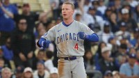 Chicago Cubs outfielder Pete Crow-Armstrong (4) celebrates after hitting a triple against the Los Angeles Dodgers during the ninth inning of the game at Dodger Stadium.