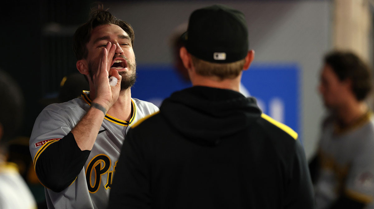 Pittsburgh Pirates starting pitcher Andrew Heaney (45, left) talks to his teammates in the dugout during the sixth inning against the Los Angeles Angels at Angel Stadium.