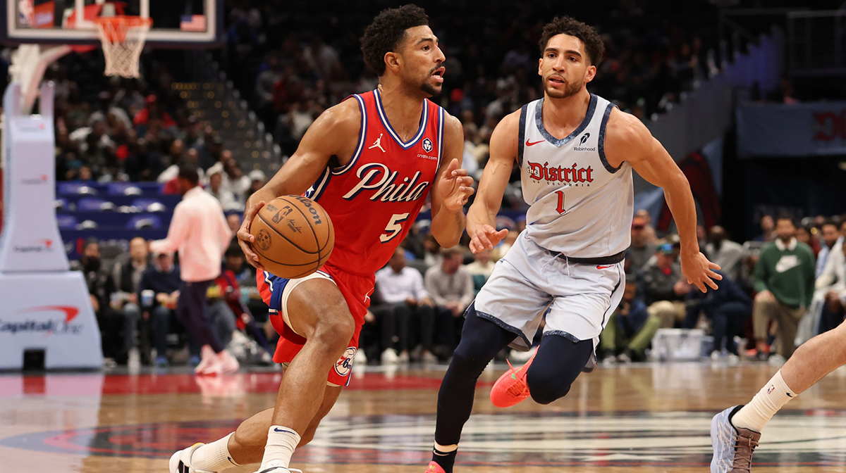 Philadelphia 76ers guard Quentin Grimes (5) drives to the basket as Washington Wizards guard Colby Jones (1) depends in the first half at Capital One Arena.