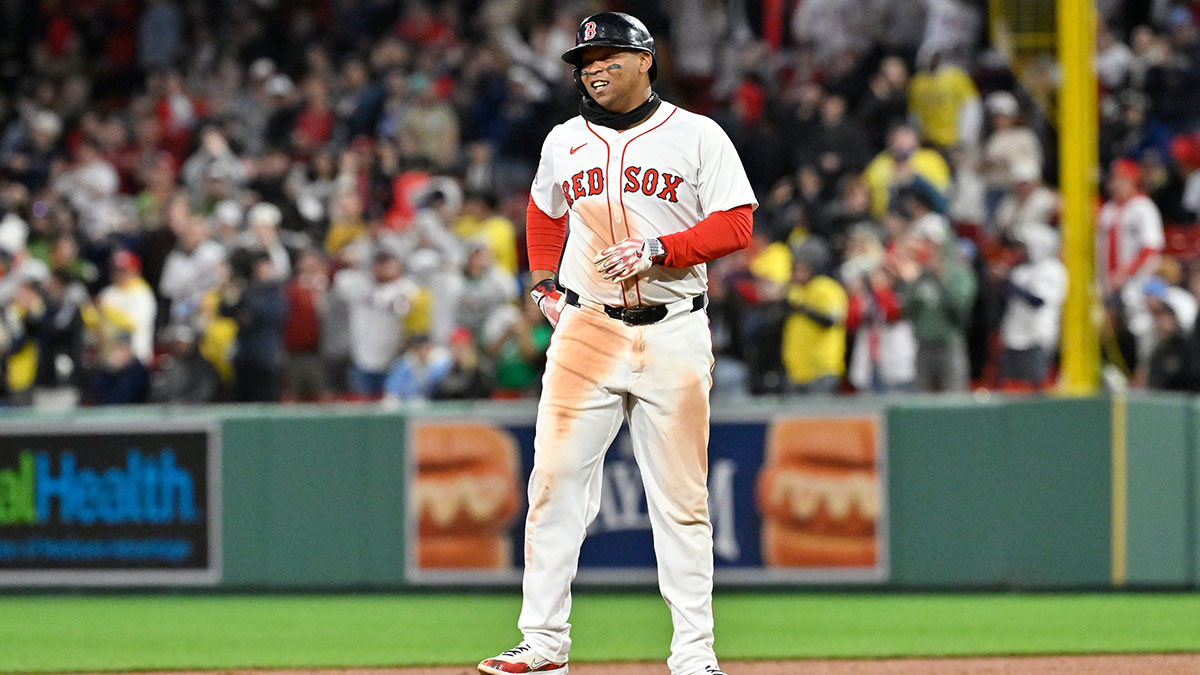 Boston Red Sox designated hitter Rafael Devers (11) reacts to his RBI double against the St. Louis Cardinals during the sixth inning at Fenway Park.