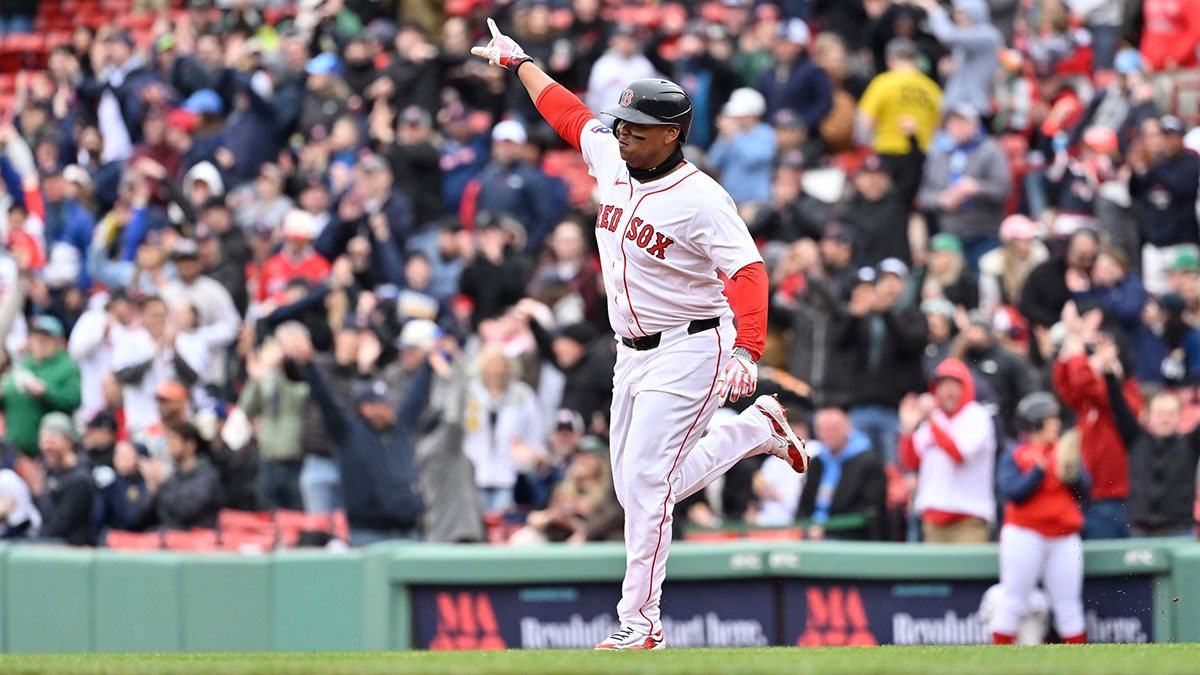 Boston Red Sox designated hitter Rafael Devers (11) reacts to hitting a home run against the St. Louis Cardinals during the fifth inning at Fenway Park.