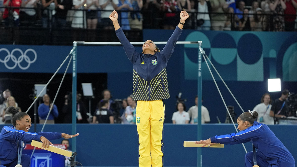 Simone Biles and Jordan Chiles bow to gold medalist Rebeca Andrade of Brazil on the floor exercise on day three of the gymnastics event finals during the Paris 2024 Olympic Summer Games.