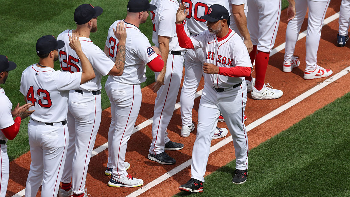 Red Sox manager Alex Cora (13) is introduced