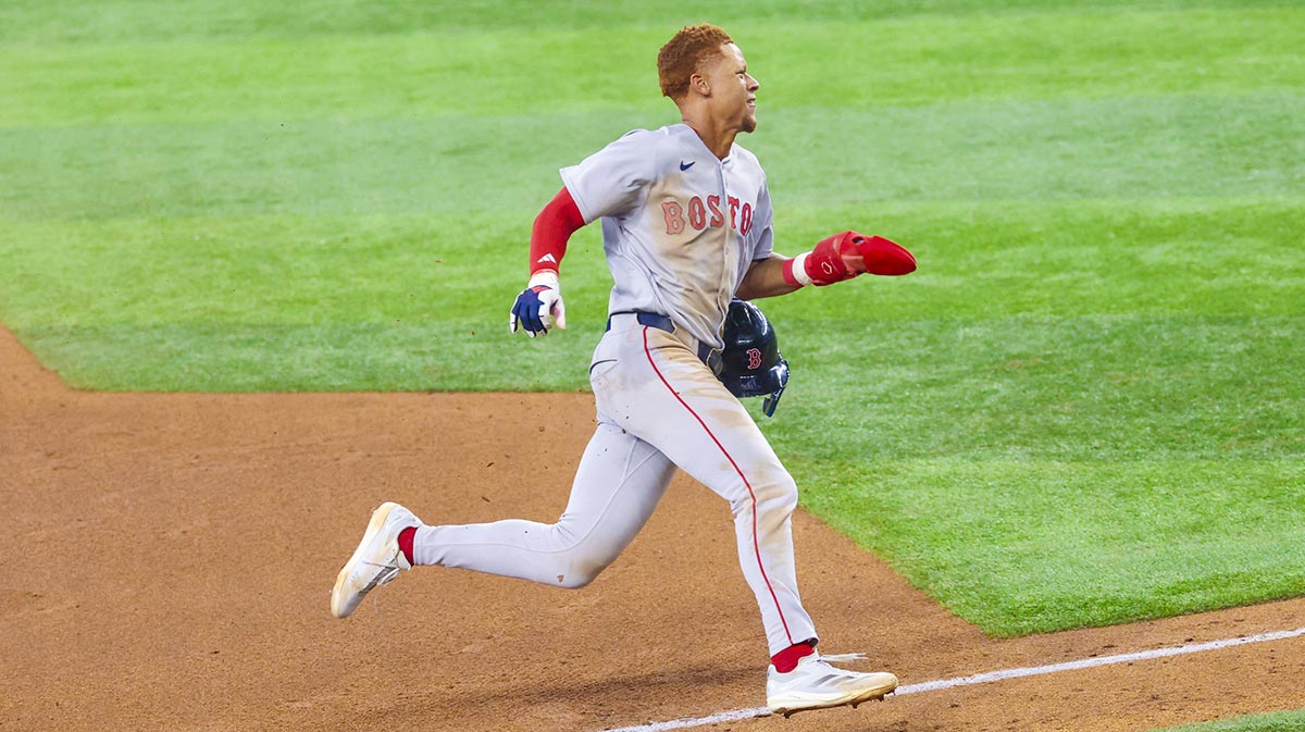 Boston Red Sox second baseman Kristian Campbell (28) rounds third base and scores during the sixth inning against the Texas Rangers at Globe Life Field.