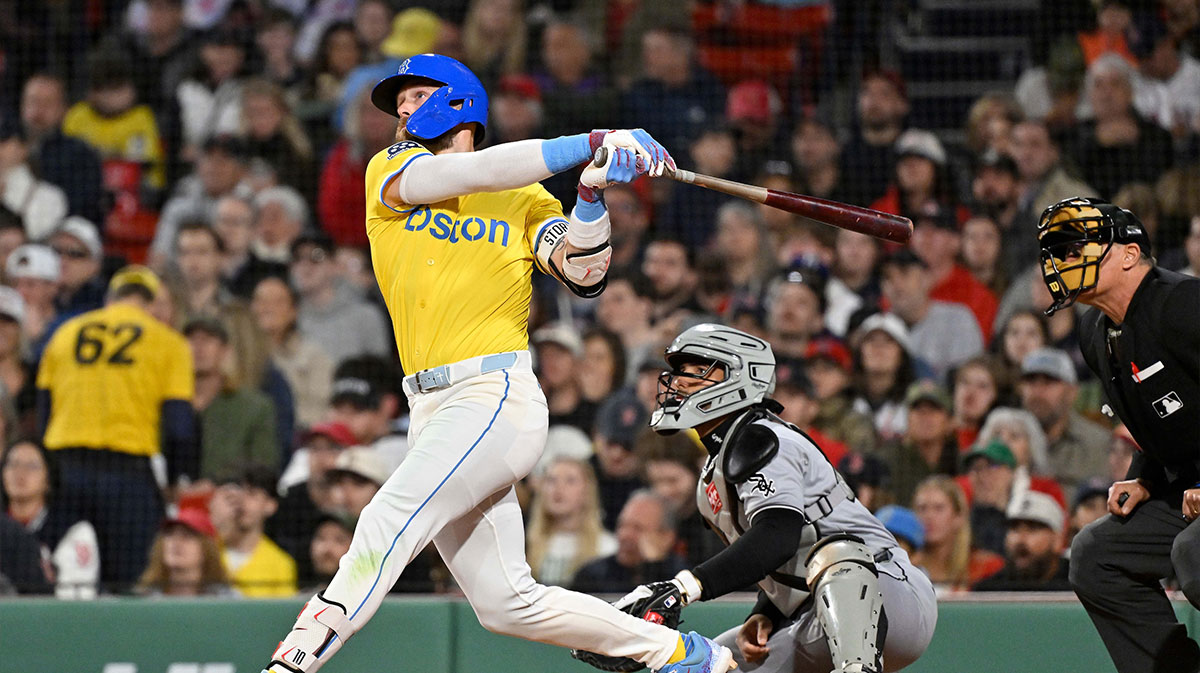 Boston Red Sox shortstop Trevor Story (10) hits a two-run home run against the Chicago White Sox during the seventh inning at Fenway Park.