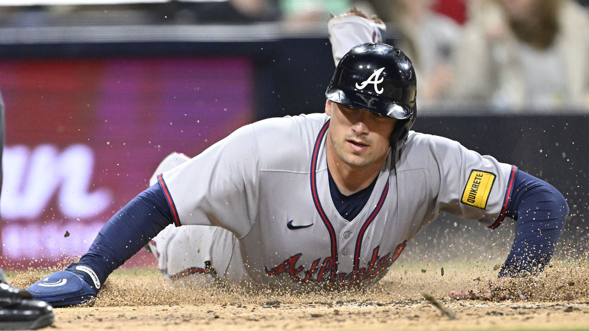 Atlanta Braves third baseman Austin Riley (27) slides as he scores during third inning against the San Diego Padres at Petco Park