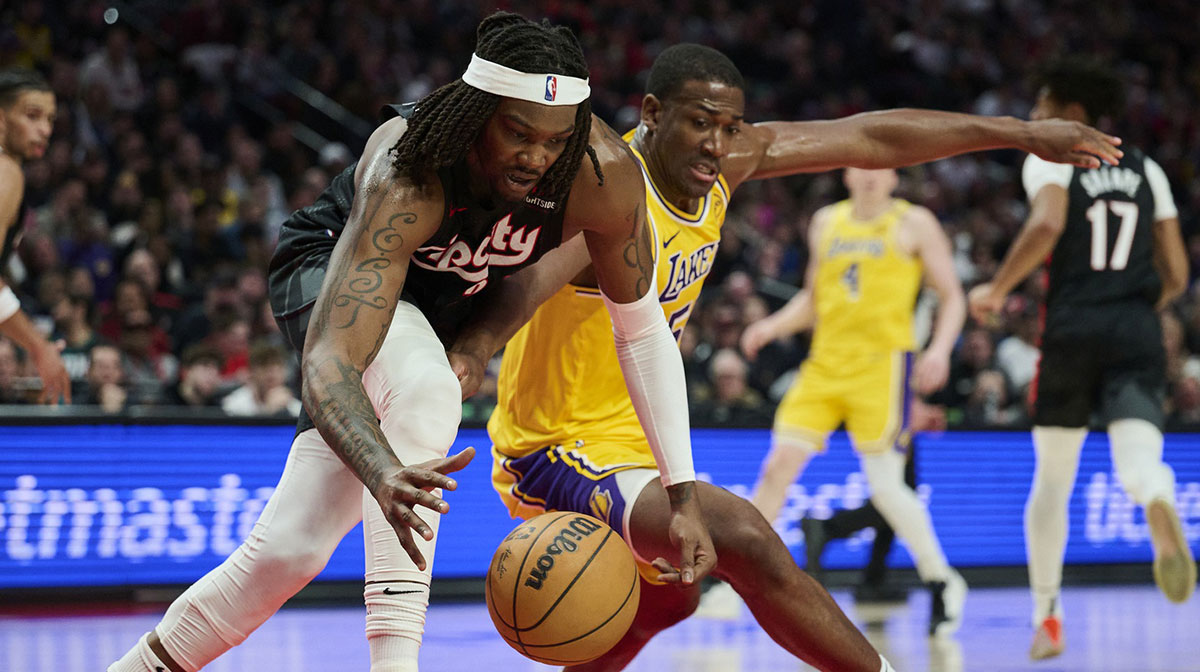 Portland Trail Blazers center Robert Williams III (35) and Los Angeles Lakers center Trey Jemison III (55) battle for control of a lose ball during the second half at Moda Center.