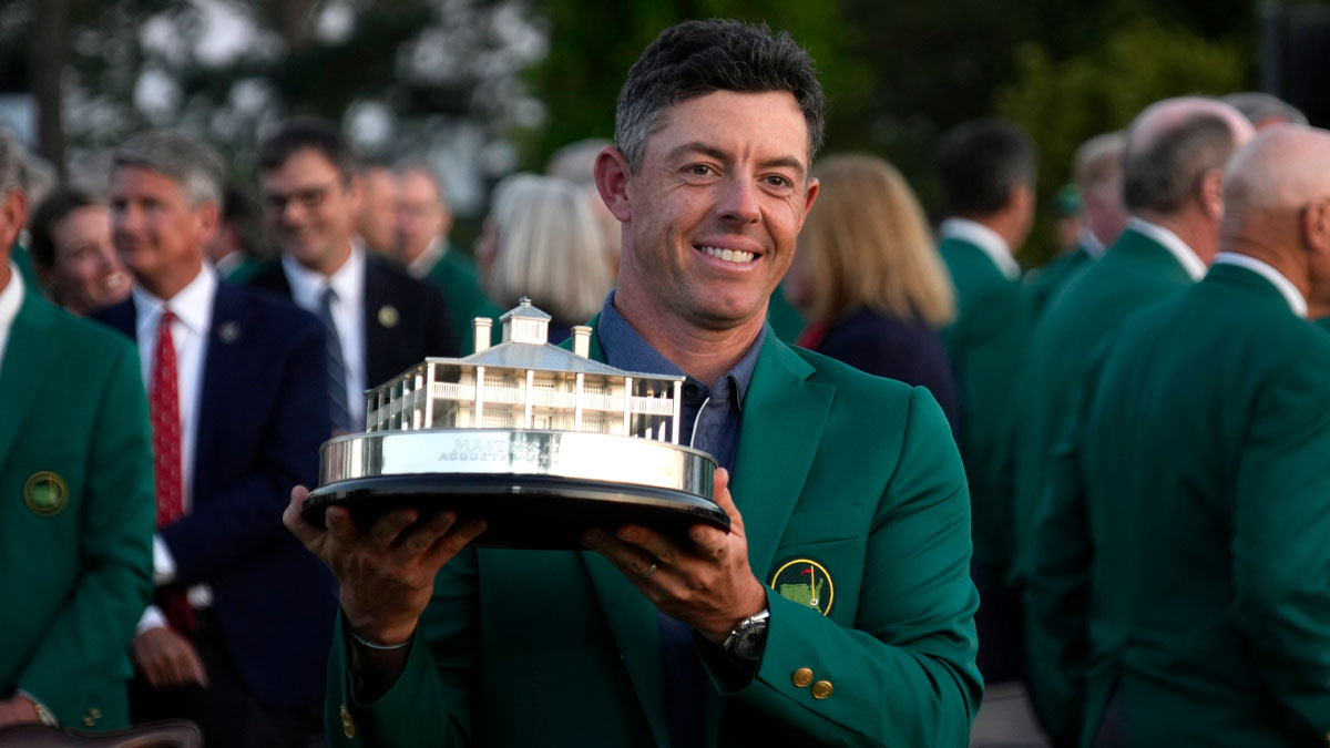 Rory McIlroy celebrates with the trophy after winning the Masters Tournament at Augusta National Golf Club.