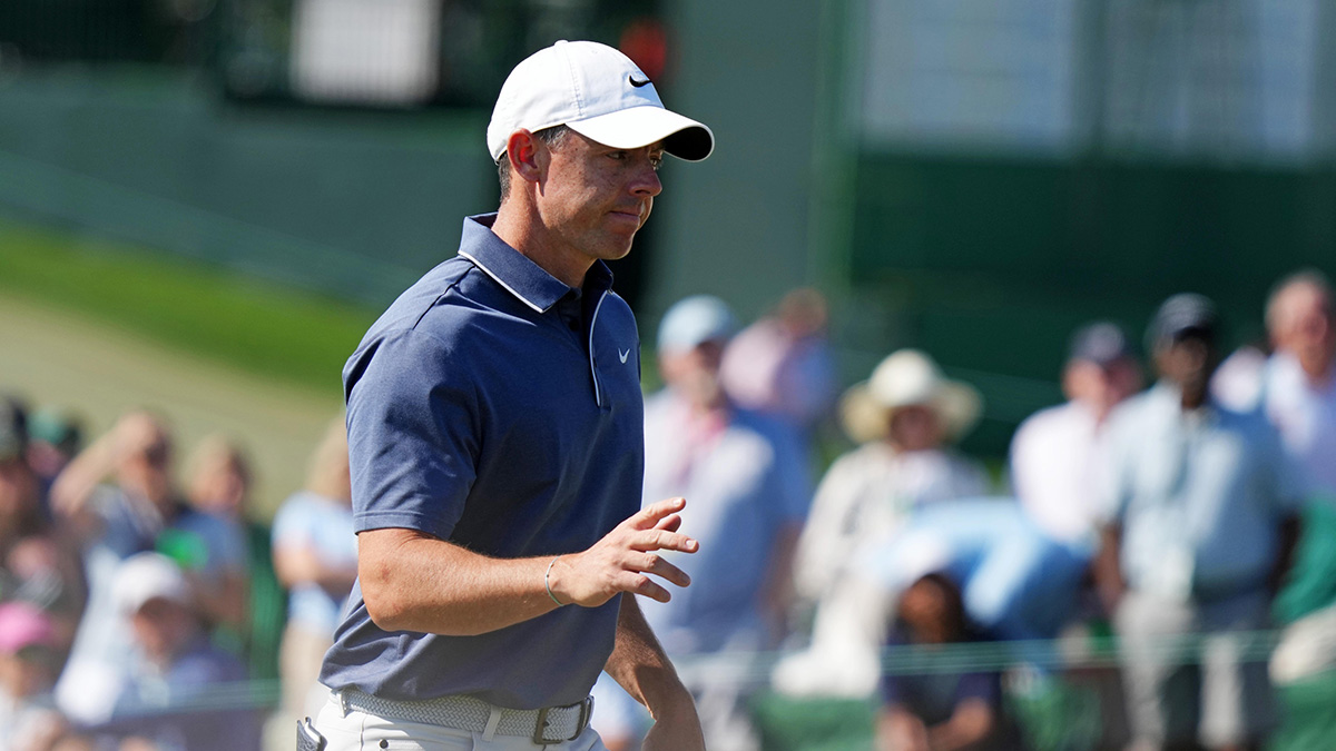 Rory McIlroy waves to the patrons as he walks up on the ninth green during the final round of the Masters Tournament at Augusta National Golf Club.