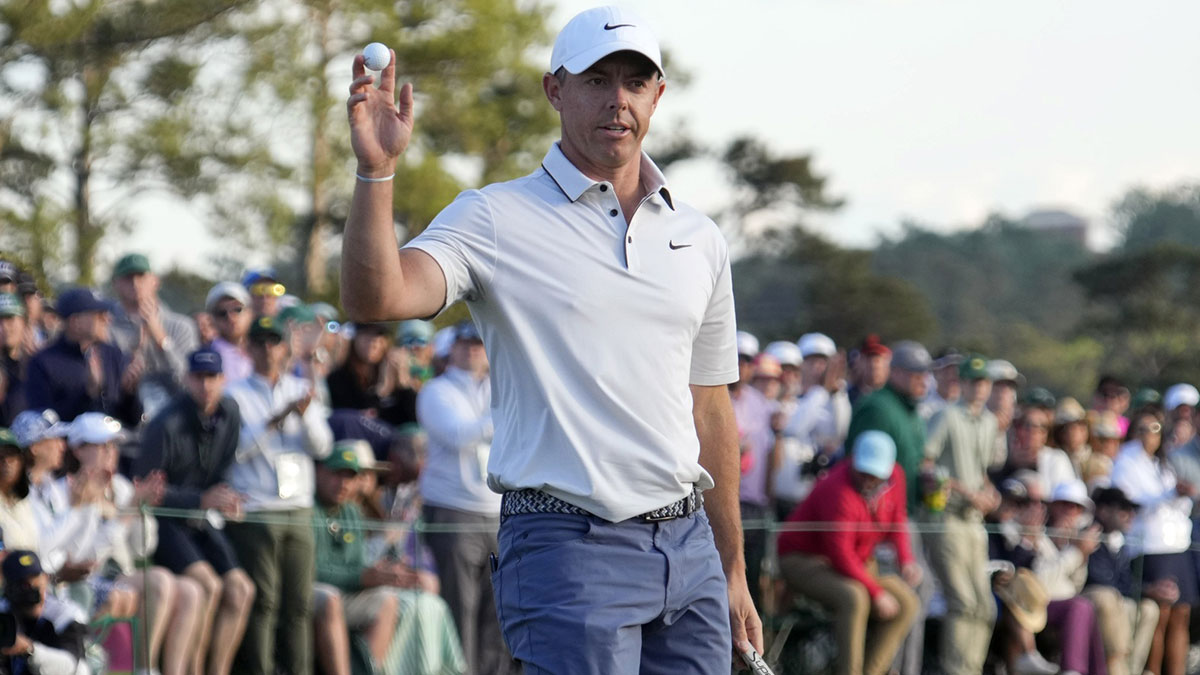Rory McIlroy reacts after putting on the 18th green during the third round of the Masters Tournament at Augusta National Golf Club.