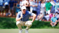 Rory Mcllroy lines up a putt on the fifth green during the third round of The Players Championship golf tournament.