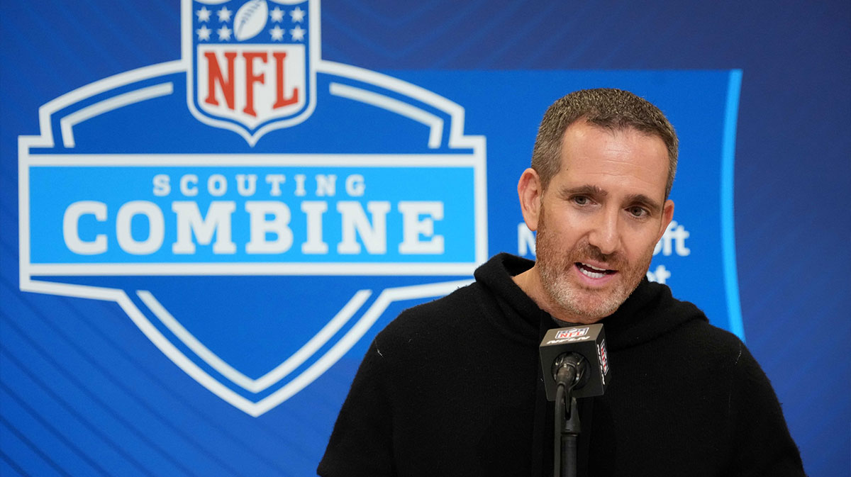 Eagles GM Howie Roseman with NFL Draft logo behind.