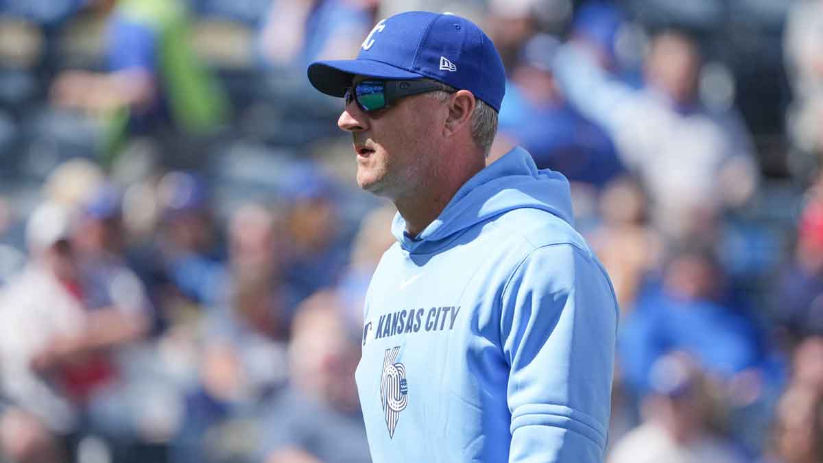 Kansas City Royals manager Matt Quatraro (33) returns to the dugout after a visit to the mound against the Minnesota Twins in the sixth inning at Kauffman Stadium.
