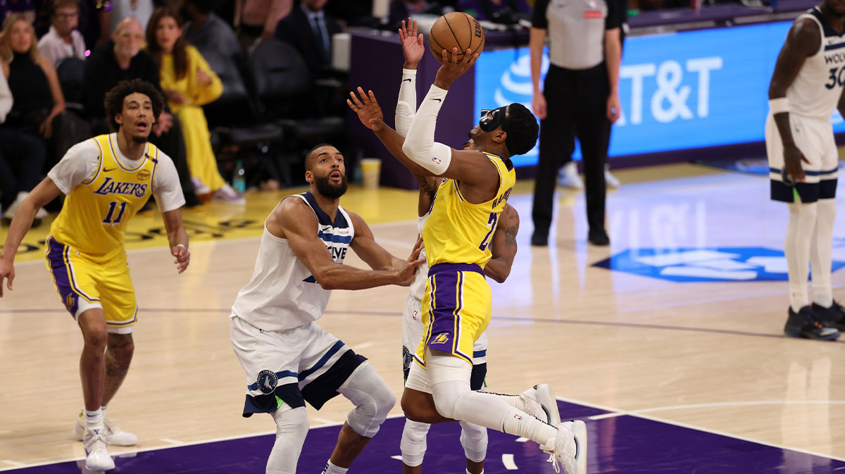 Los Angeles Lakers forward Rui Hachimura (28) goes to the basket against Minnesota Timberwolves center Rudy Gobert (27) during the third quarter of game two of first round for the 2024 NBA Playoffs at Crypto.com Arena.