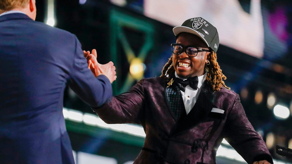 Running back Ashton Jeanty slaps hands with NFL Commissioner Roger Goodell after being selected sixth overall by the Las Vegas Raiders during the first round of the 2025 NFL Draft