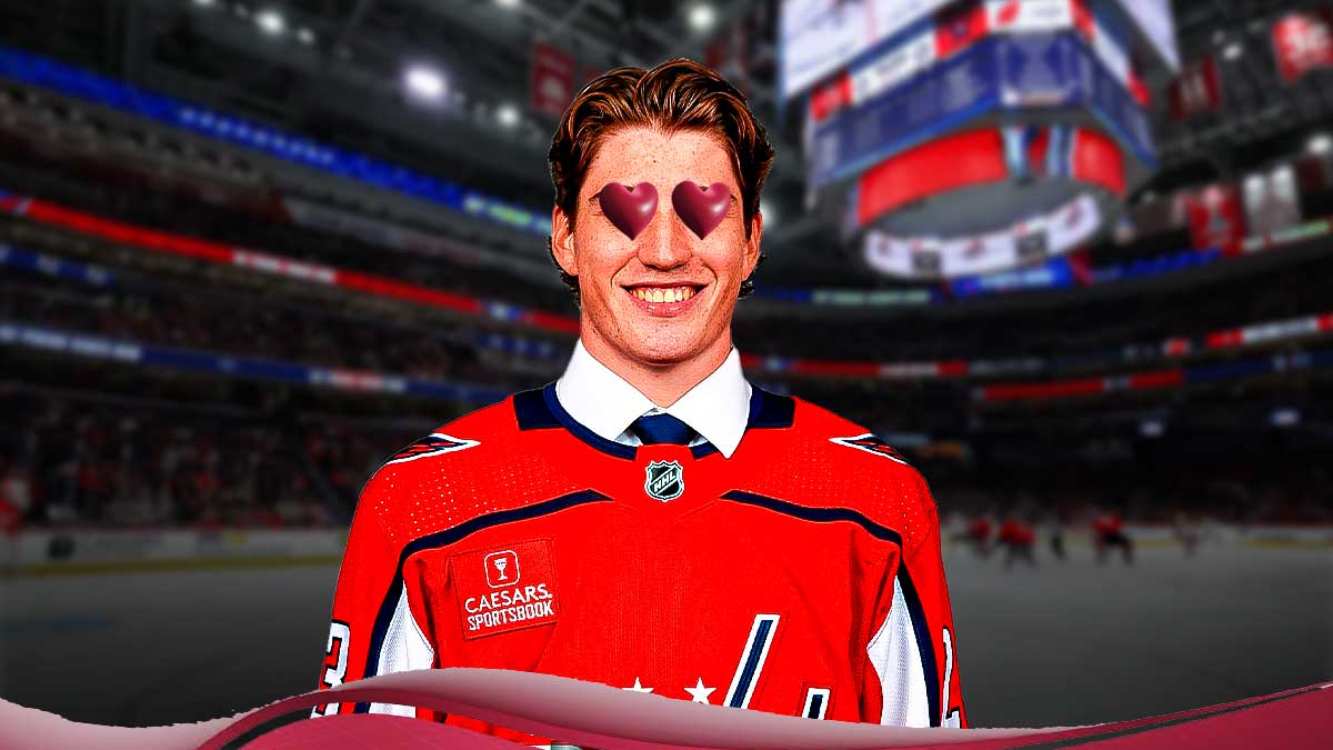 Capitals player Ryan Leonard with hearts over his eyes, with Capitals player Alex Ovechkin next to him