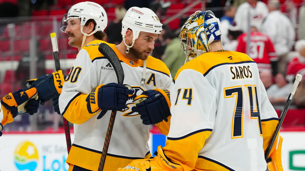 Nashville Predators goaltender Juuse Saros (74) and center Ryan O'Reilly (90) celebrates their victory against the Carolina Hurricanes at Lenovo Center.