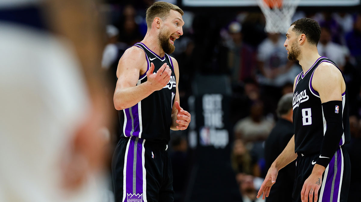 Sacramento Kings star Domantas Sabonis looking at Zach LaVine.