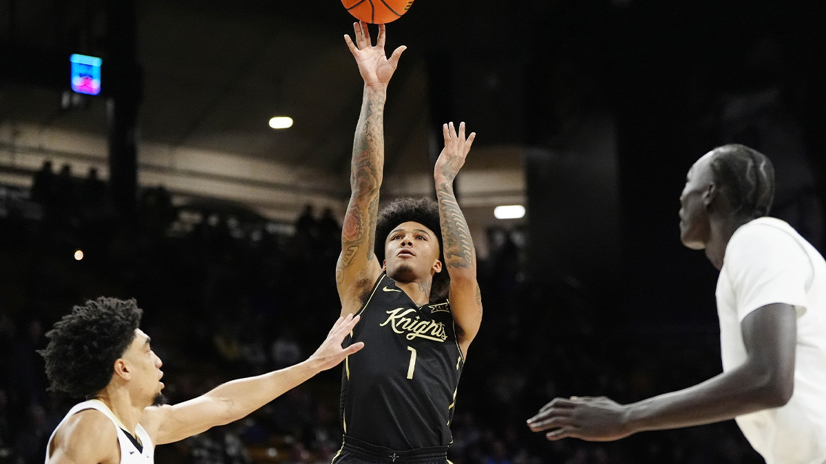 UCF Knights guard Mikey Williams (1) shoots the ball in the first half against the Colorado Buffaloes at the CU Events Center.