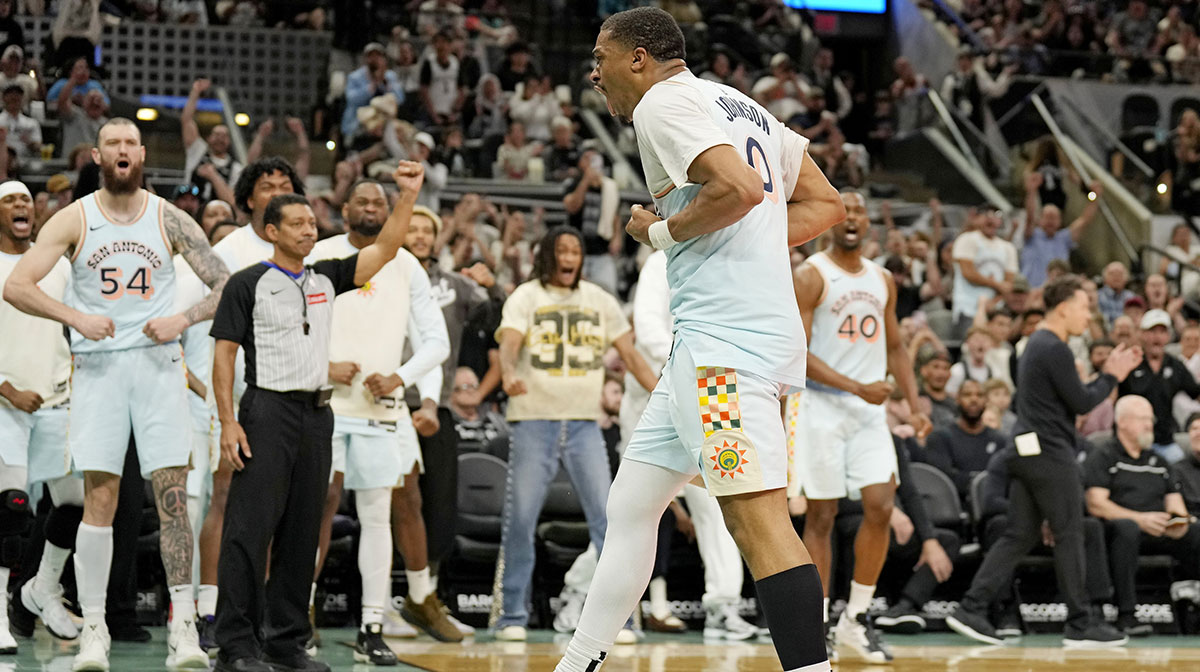 San Antonio Spurs forward Keldon Johnson (0) and teammates react after drawing a foul on a basket during the second half against the Toronto Raptors at Frost Bank Center.