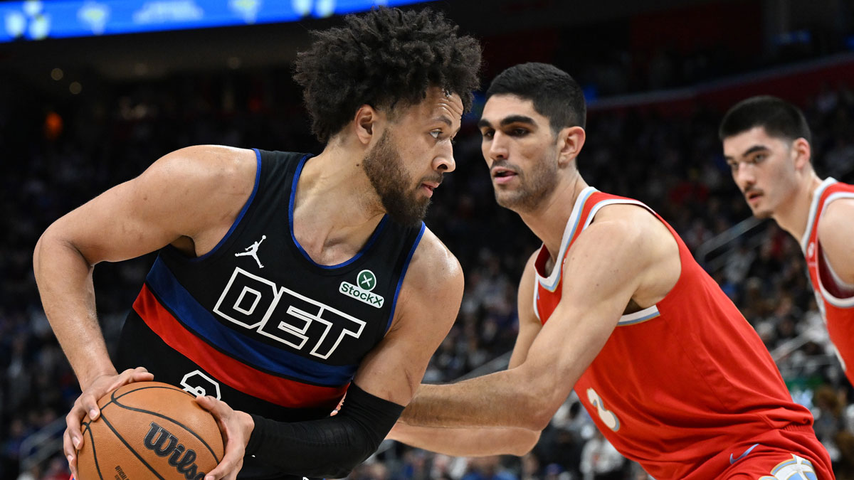 Detroit Pistons guard Cade Cunningham (2) looks to drive past Memphis Grizzlies forward Santi Aldama (7) in the first quarter at Little Caesars Arena.
