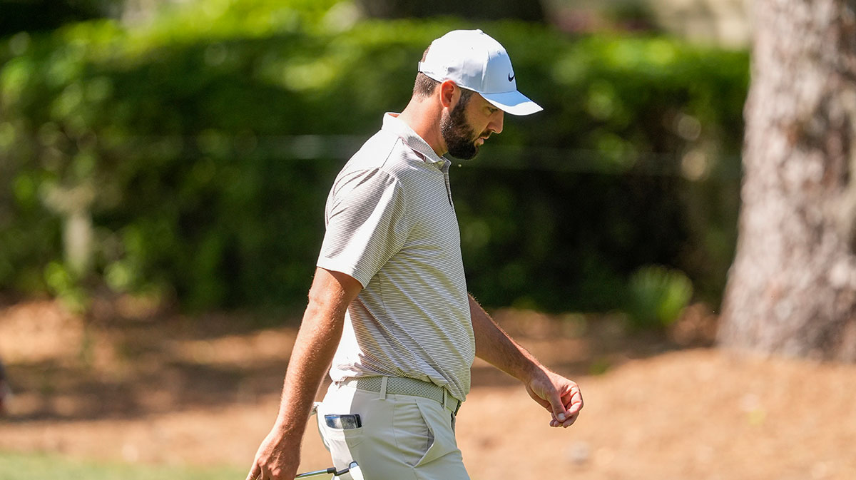Scottie Scheffler walks towards the eighth green during the first round of the RBC Heritage golf tournament