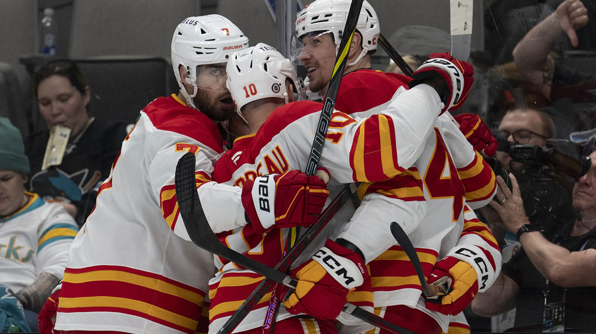 Calgary Flames defenseman Kevin Bahl (7), left wing Jonathan Huberdeau (10) and right wing Adam Klapka (43) celebrate during the third period against the San Jose Sharks at SAP Center at San Jose.