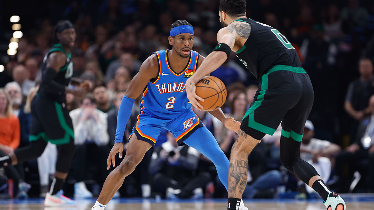 Oklahoma City Thunder guard Shai Gilgeous-Alexander (2) defends Boston Celtics forward Jayson Tatum (0) during the second quarter at Paycom Center.