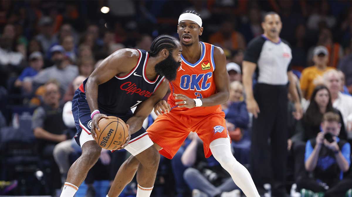 Oklahoma City Thunder guard Shai Gilgeous-Alexander (2) defends a drive by Los Angeles Clippers guard James Harden (1) during the second quarter at Paycom Center.