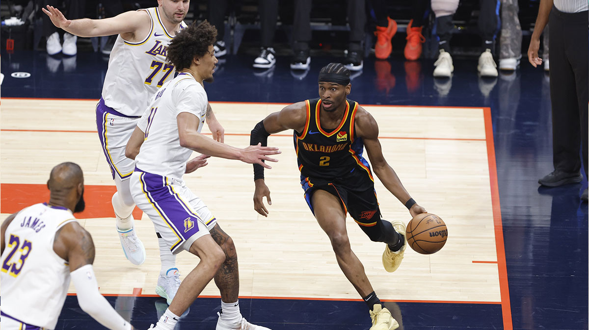 Oklahoma City Thunder guard Shai Gilgeous-Alexander (2) drives around Los Angeles Lakers center Jaxson Hayes (11) during the first quarter at Paycom Center.