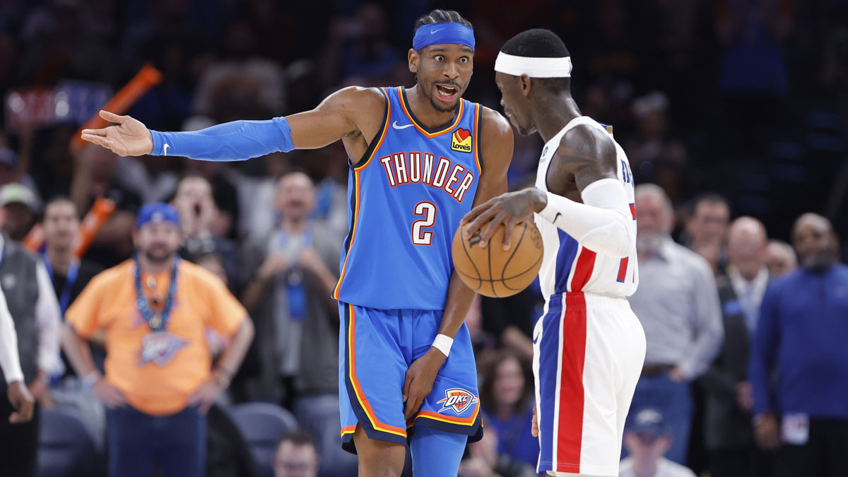 Oklahoma City Thunder guard Shai Gilgeous-Alexander (2) and Detroit Pistons guard Dennis Schroder (17) talk during the second half at Paycom Center.