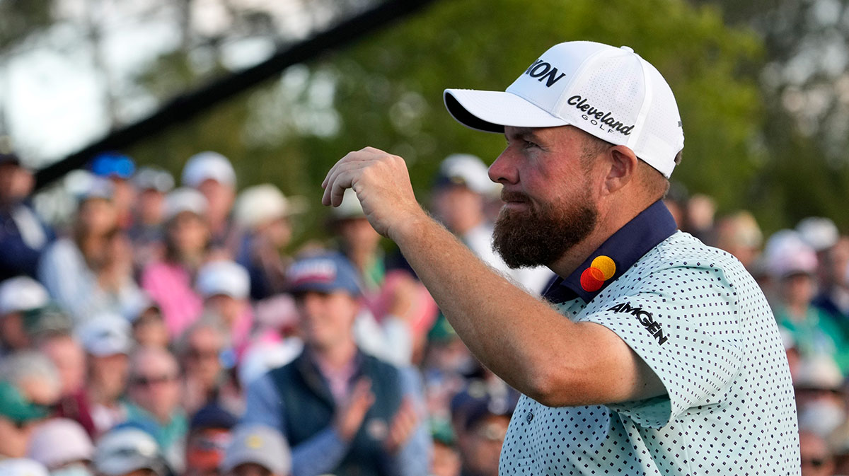 Shane Lowry reacts after putting on the 18th green during the third round of the Masters Tournament at Augusta National Golf Club.