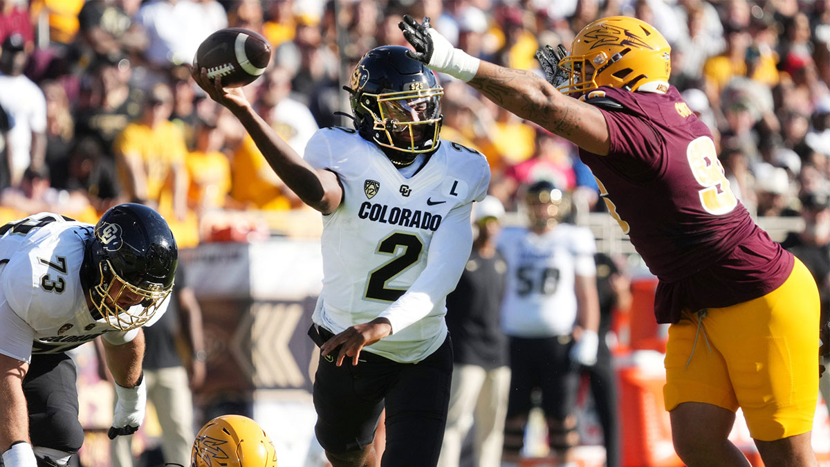 ASU Sun Devils defensive lineman Anthonie Cooper (96) tries to block the pass of Colorado Buffaloes quarterback Shedeur Sanders (2) at Mountain America Stadium on Oct 7, 2023.