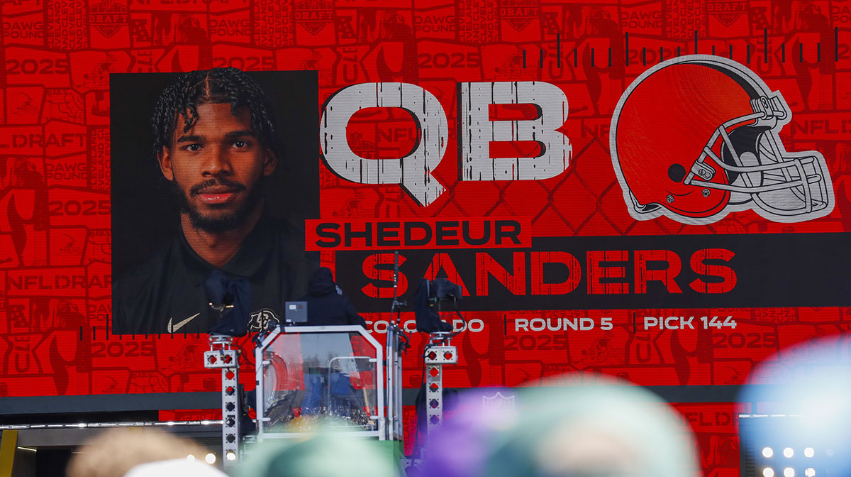 A graphic announcing Colorado quarterback Shedeur Sanders’ selection by the Cleveland Browns with the 144th overall pick is seen in the Draft Theater during the third day of the 2025 NFL Draft at Lambeau Field.