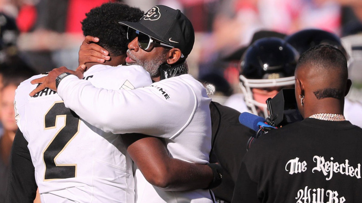 Shedeur — who slid in the 2025 NFL Draft before the Cleveland Browns selected him — and his father/coach at Colorado Deion Sanders before a game against Texas Tech.