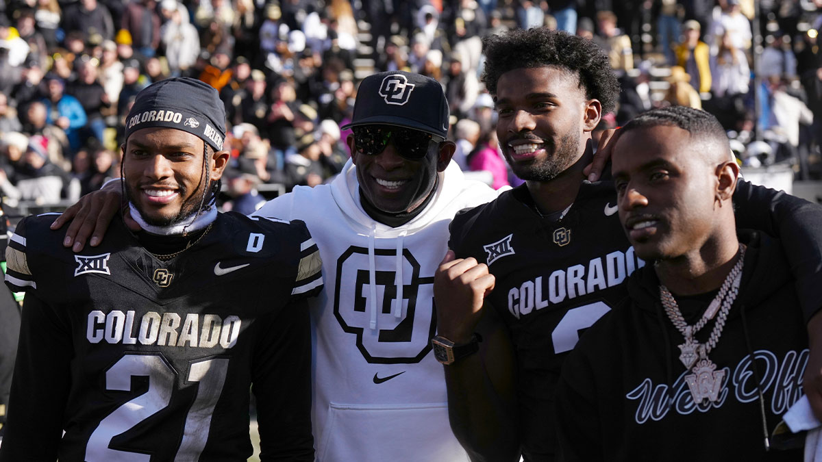 Nov 29, 2024; Boulder, Colorado, USA; Colorado Buffaloes safety Shilo Sanders (21) and head coach Deion Sanders and quarterback Shedeur Sanders (2) and social media producer Deion Sanders Jr. following the win against the Oklahoma State Cowboys at Folsom Field.
